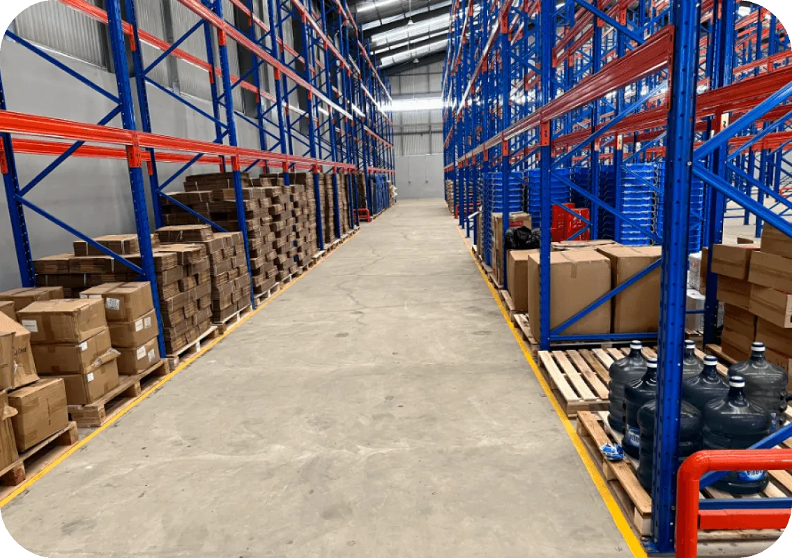 an aisle view of f-commerce  warehouse shelves